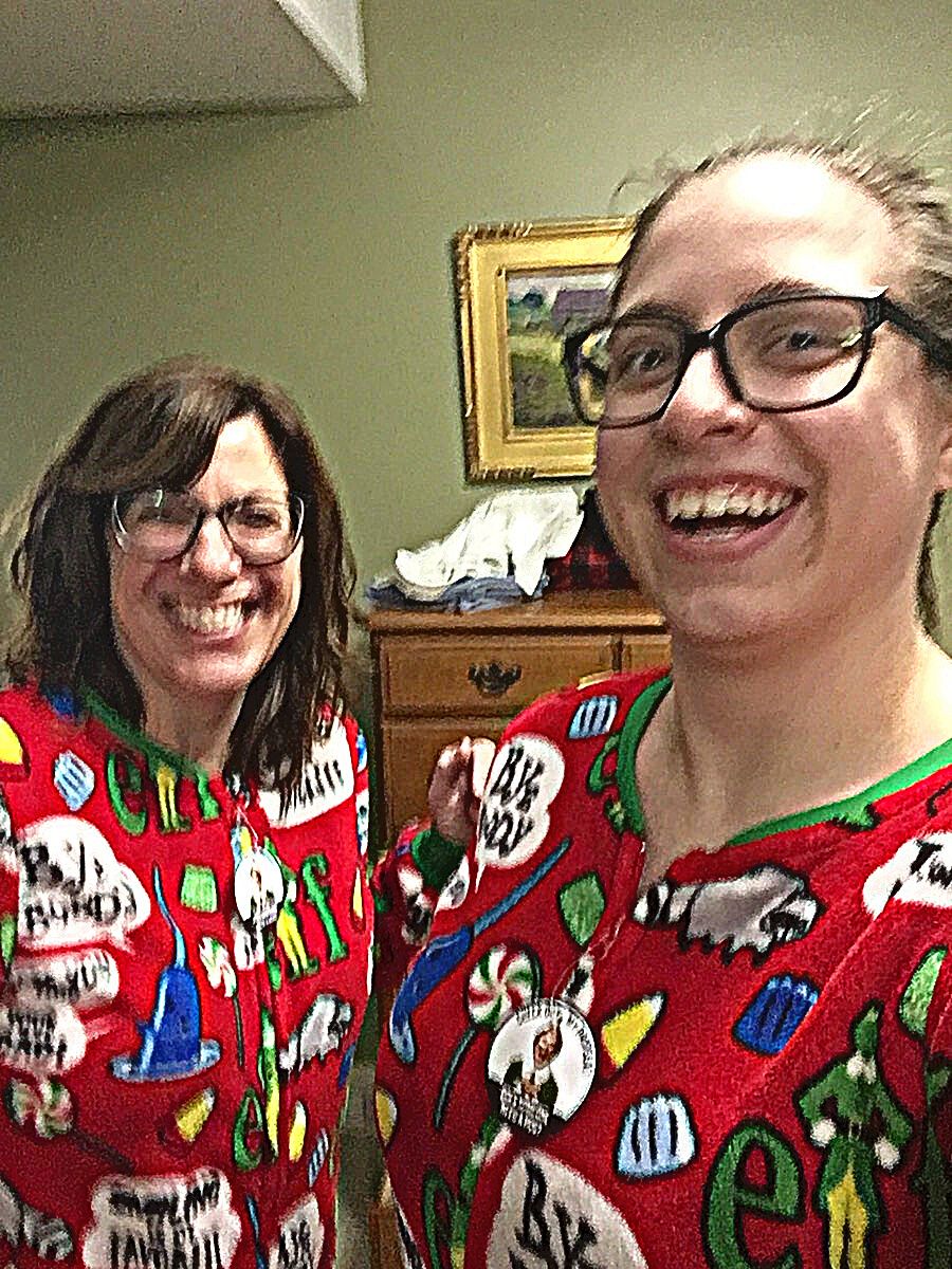 Leah and jane wearing matching elf christmas pjs